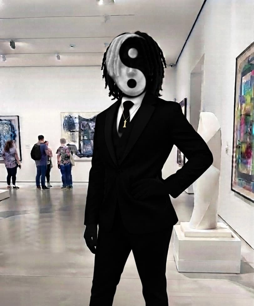 Surreal figure in a black suit with a Yin-Yang head in an art gallery.